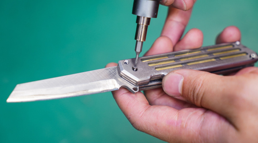 assembling pocketknife made from waterjet cut metals