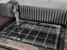 wazer waterjet cutting bed with glass