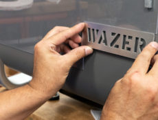 wazer nameplate being applied to machine