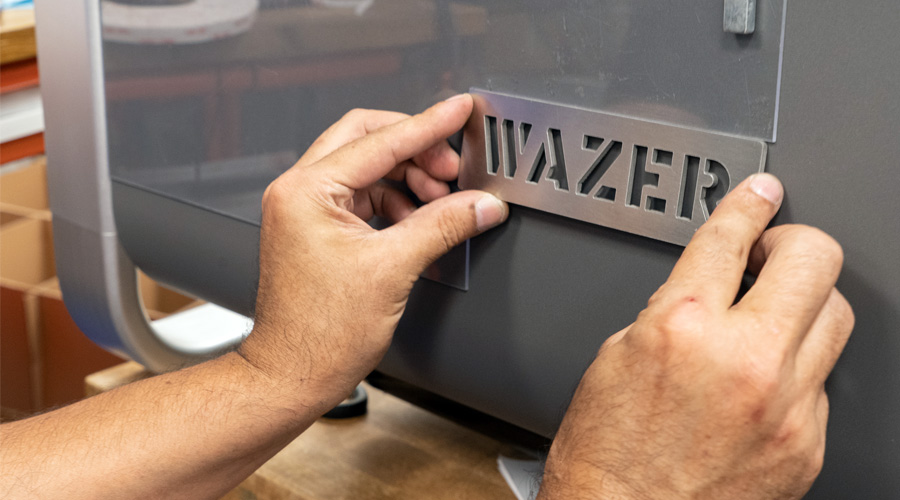 wazer nameplate being applied to machine