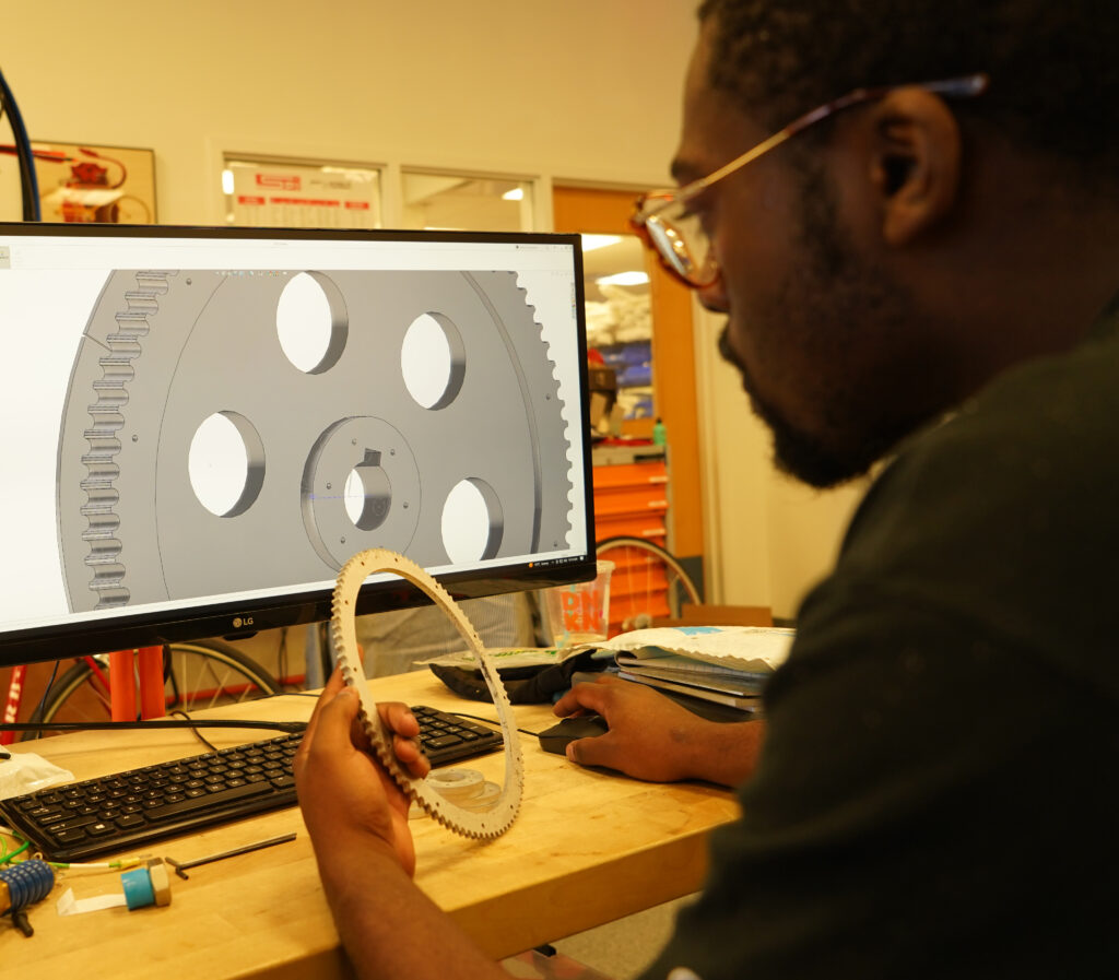 engineer studying CAD design for 
 waterjet cutting on computer screen